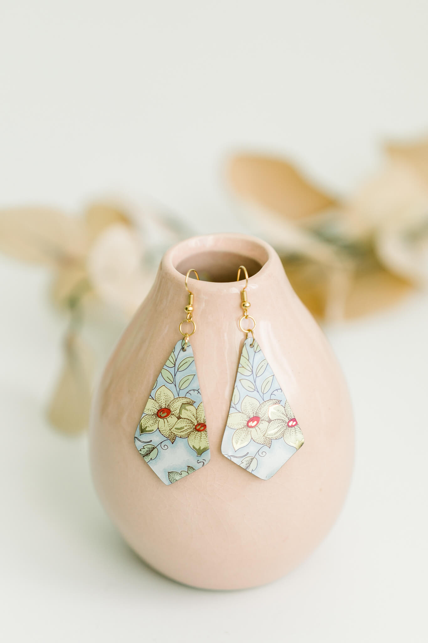 Drop earrings made from a vintage tin  by jewelry designer Amy Gates.