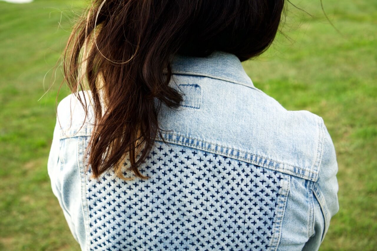 Hand embroidery on a jacket by Reina Nishida-Lee founder of Ottotto.