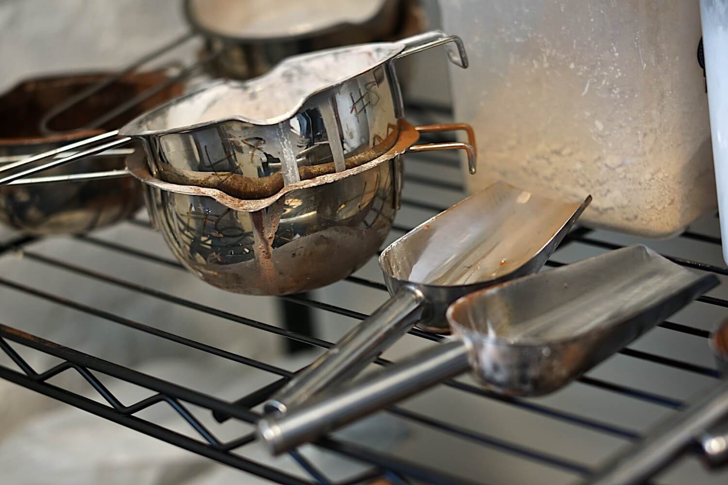 Stainless steel bowls and scoopers that Sabine uses to make skin tone crayons.