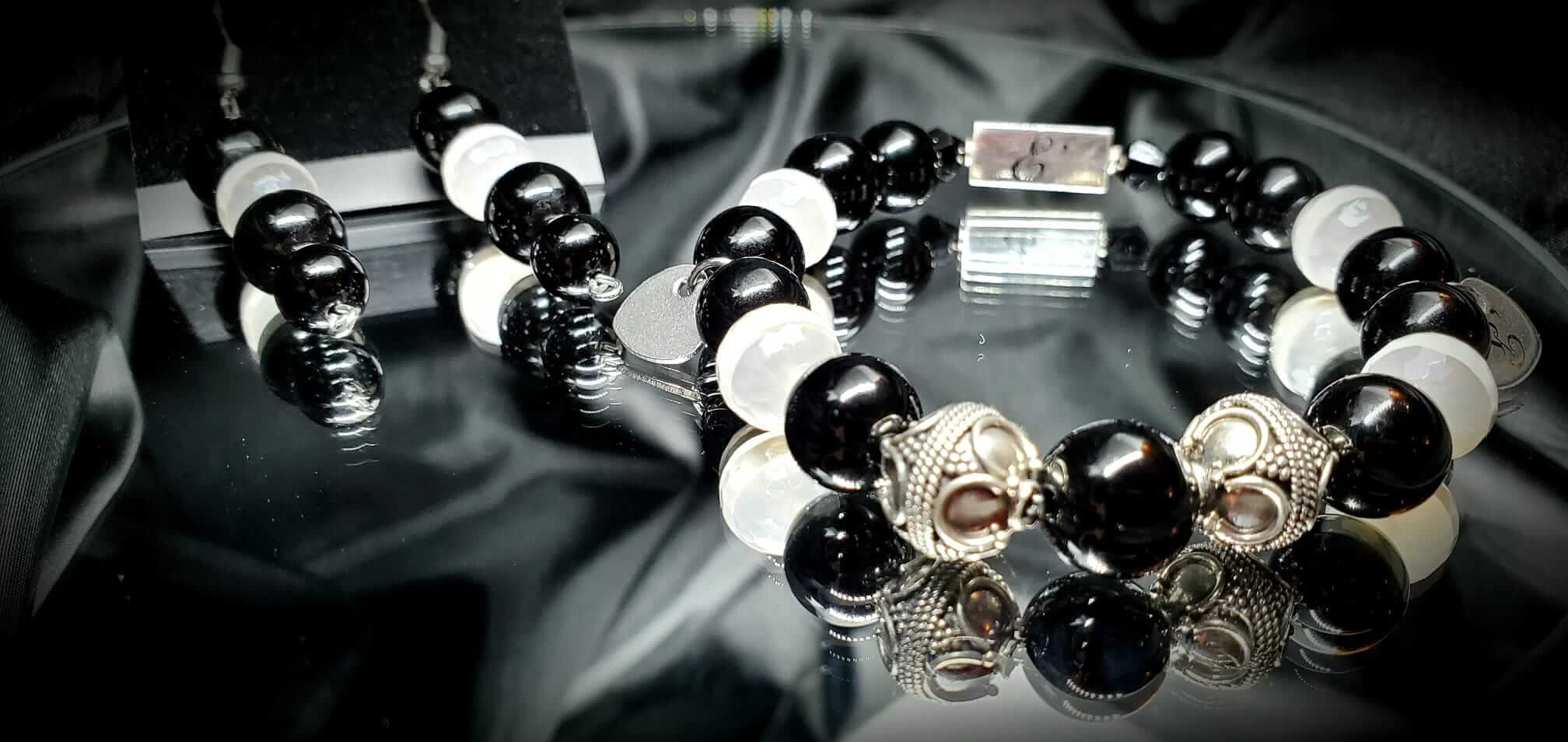 Handmade luxury beaded bracelet from E'lur Wrist Designs. The bracelet features black and white gemstone beads and silver beads with silver findings.