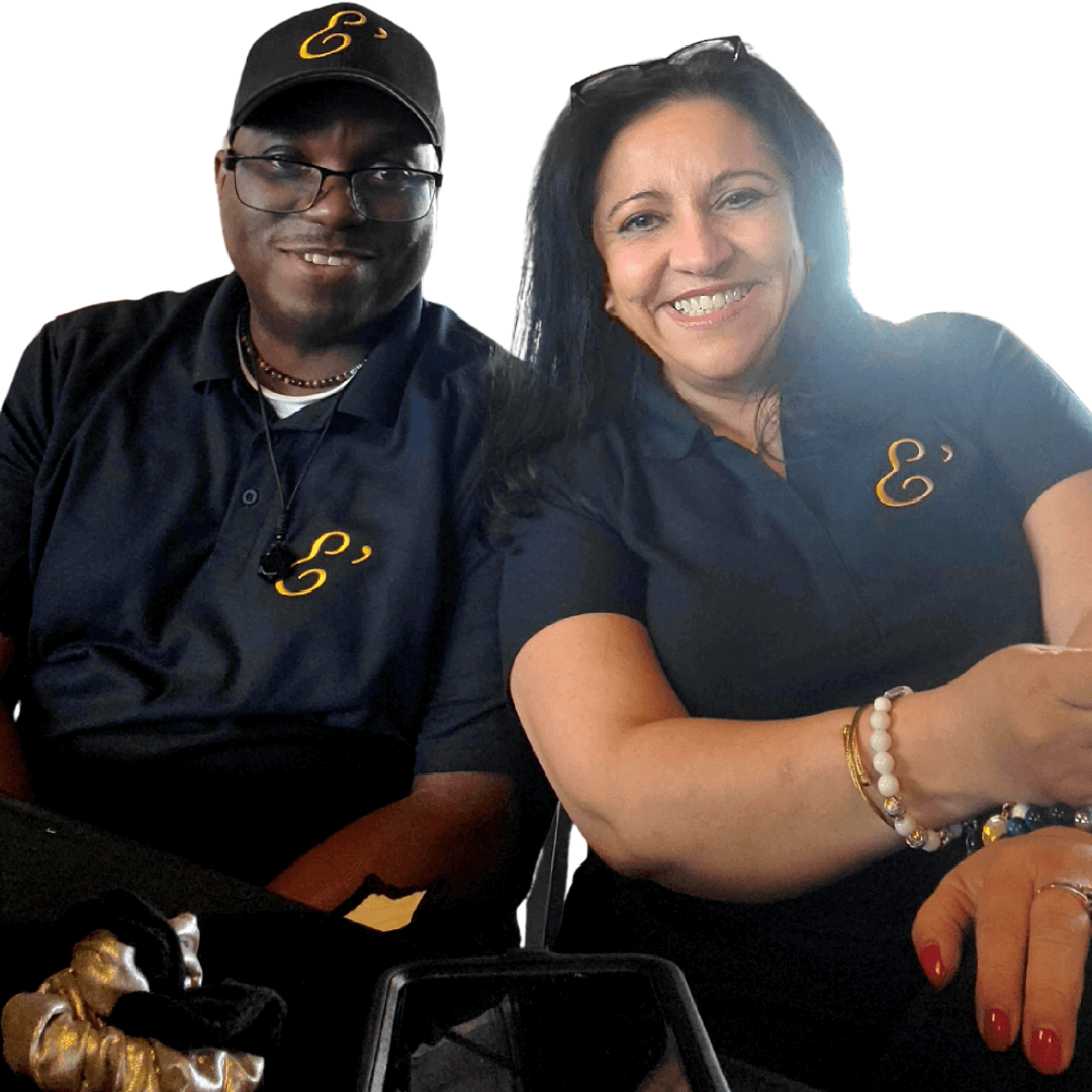 Shawn Rule and Djennin Casab, partners at E'lur Wrist Designs. They are wearing navy blue polo shirts with the E'lur logo in a gold color.